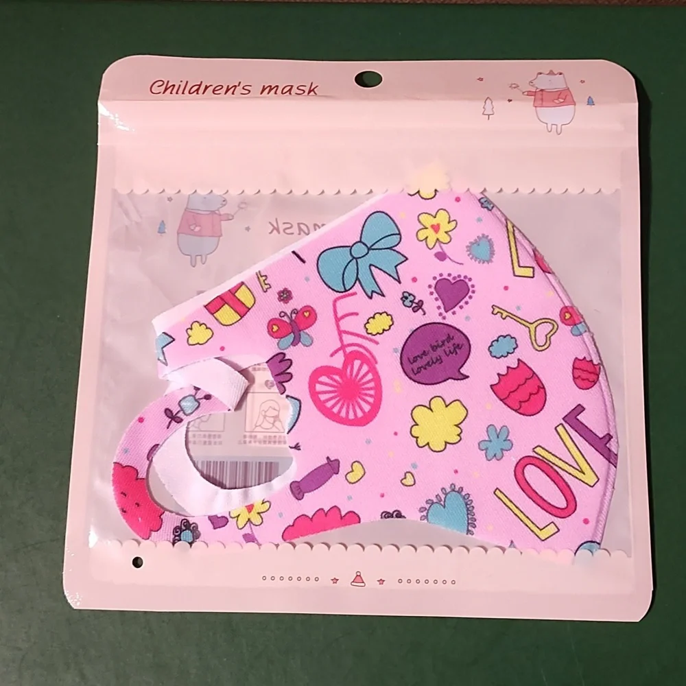 Children's re Usable face mask new in package never opened